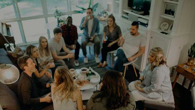 group of young adults meeting in a living room