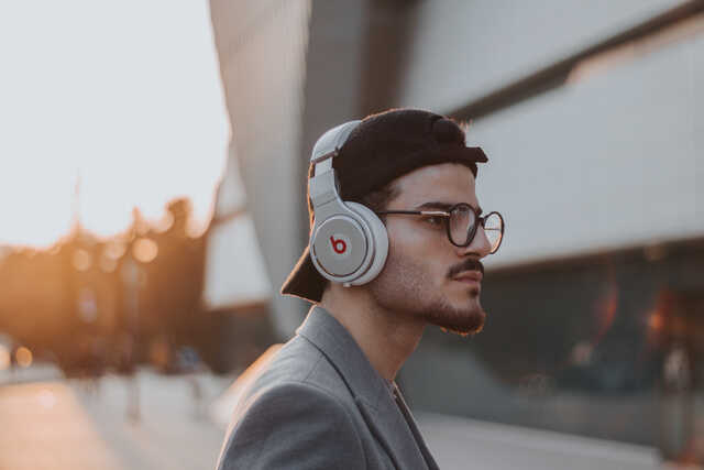 young man listening to headphones